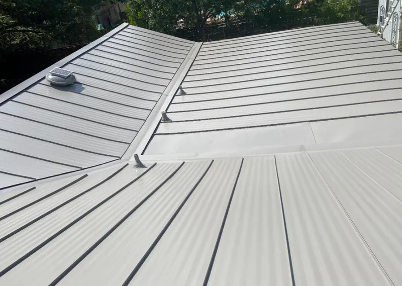 Solar attic fan installed on a metal roof for Roof Ventilation in Green Valley